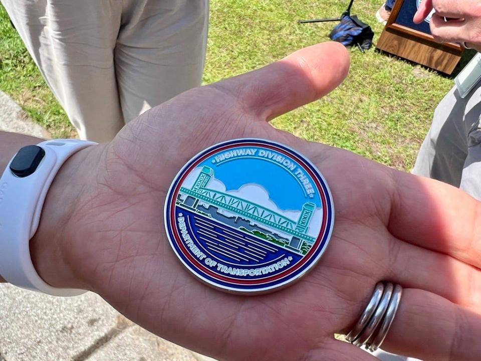 During a news conference on Tuesday, May 7, 2024, challenge coins commemorating the Cape Fear Memorial Bridge project were given to various employees who played vital roles in the completion of the project.