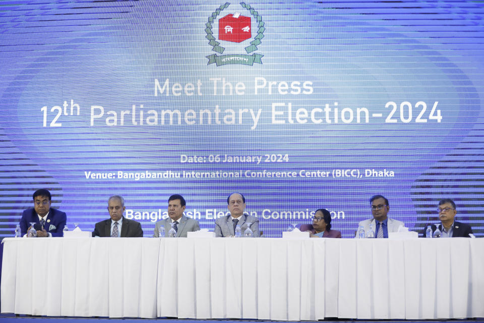 Chief Election Commissioner Kazi Habibul Awal, center, and other officers of the election commission addres the press in Dhaka, Bangladesh, Saturday, Jan. 6, 2024. The Election Commission said ballot boxes and other election supplies had been distributed in preparation for the vote on Sunday in over 42,000 precincts. There are more than 119 million registered voters. (AP Photo/Mahmud Hossain Opu)