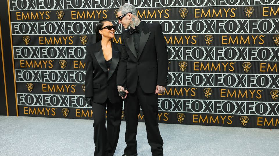 Kourtney Kardashian and Travis Barker wore his-and-hers tuxes. - Neilson Barnard/Getty Images