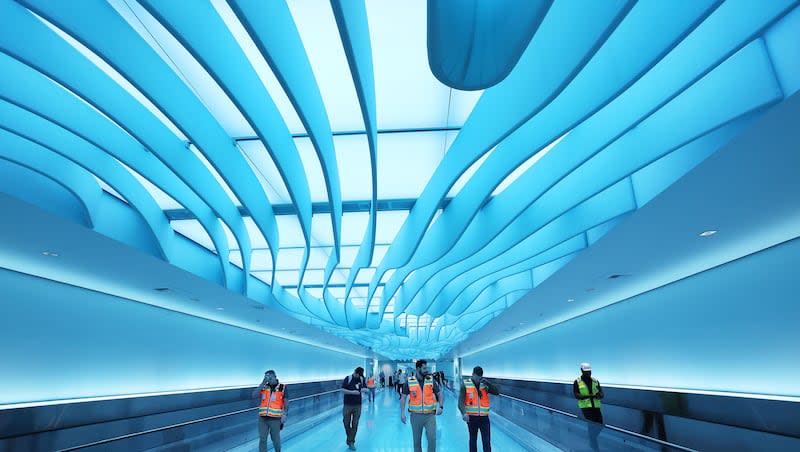 Construction workers walk through the completed Salt Lake City International Airport’s River Tunnel in Salt Lake City on Wednesday, April 3, 2024.