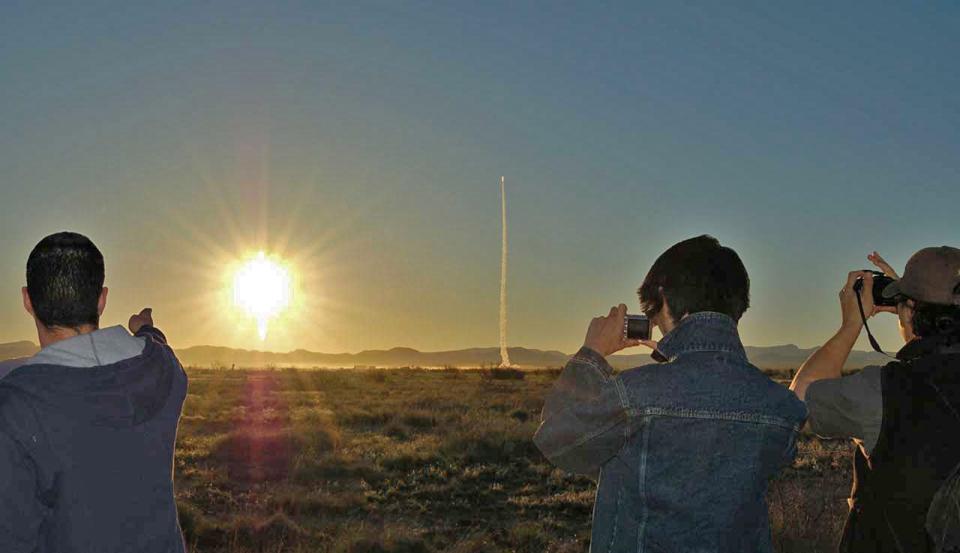 Family members watch as a Celestis memorial space flight launches to carry  ashes of a loved one into space.