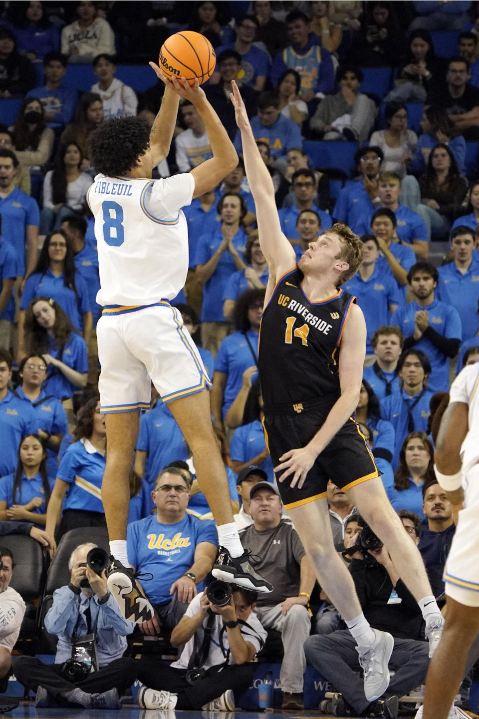 UCLA guard Ilane Fibleuil, left, shoots as UC Riverside forward Wil Tattersall defends during the first half of an NCAA college basketball game Thursday, Nov. 30, 2023, in Los Angeles. (AP Photo/Mark J. Terrill)