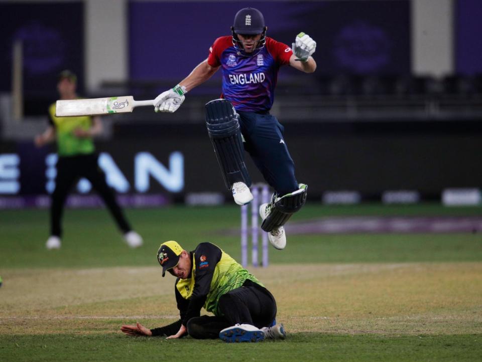 Jos Buttler hurdles Steve Smith (Reuters)