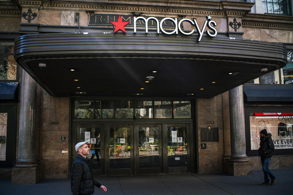 People walk by the Macy’s store on March 24, 2020 in New York City. - Credit: Getty Images