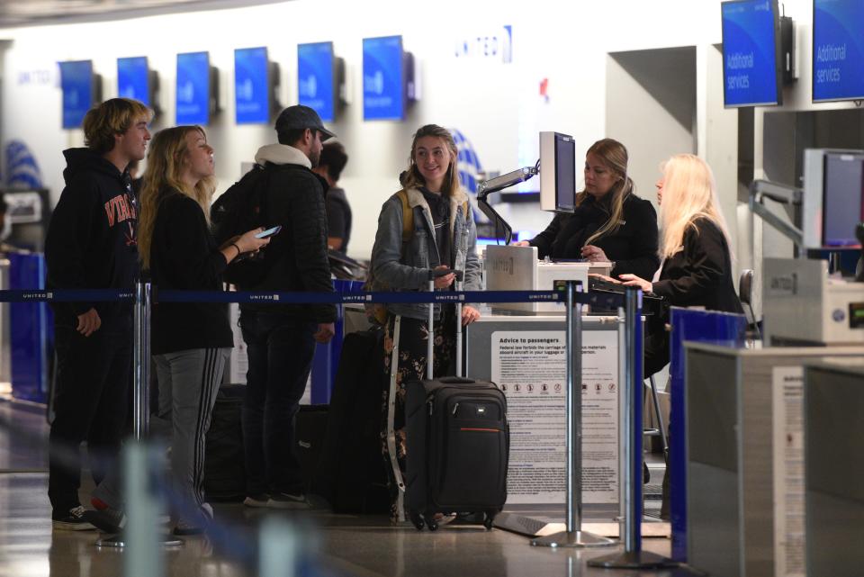 Holiday travelers check in at United Airlines at Newark Liberty International Airport on Sunday, November 25, 2018. The Transportation Security Administration is expecting Sunday to be the busiest day for Thanksgiving travel as people return home to head back to work after the holiday.