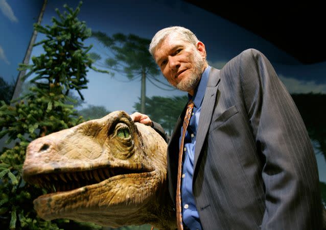 Australian-born Ken Ham  poses with one of his favorite animatronic dinosaurs during a tour of the Creation Museum in Kentucky. Source: AP