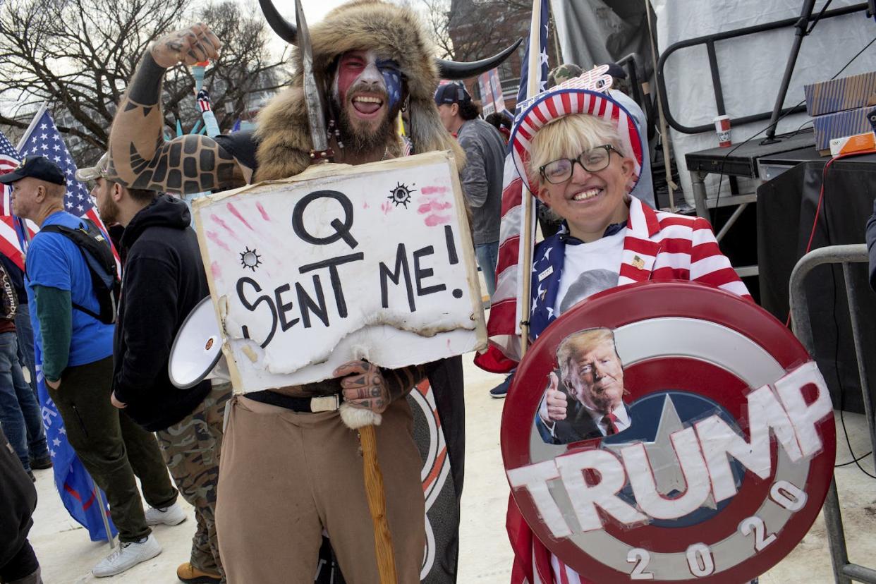 Trump supporters attend an election fraud rally in December 2020 in Washington, D.C. <a href="https://www.gettyimages.com/detail/news-photo/trump-supporter-and-qanon-follower-jake-the-q-shaman-angeli-news-photo/1297805096?adppopup=true" rel="nofollow noopener" target="_blank" data-ylk="slk:Andrew Lichtenstein/Corbis via Getty Images;elm:context_link;itc:0;sec:content-canvas" class="link ">Andrew Lichtenstein/Corbis via Getty Images </a>