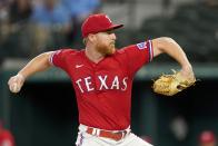 Texas Rangers starting pitcher Jon Gray throws to the Minnesota Twins in the first inning of a baseball game, Friday, July 8, 2022, in Arlington, Texas. (AP Photo/Tony Gutierrez)