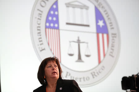 FILE PHOTO - Natalie Jaresko, Executive Director of the Federal Fiscal Control Board of Puerto Rico attends a meeting of the Financial Oversight and Management Board for Puerto Rico at the College of Engineers and Land Surveyors in San Juan, Puerto Rico October 31, 2017. REUTERS/Alvin Baez