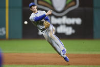 Kansas City Royals shortstop Bobby Witt Jr. attempts but cannot throw out Cleveland Guardians' Gabriel Arias at first base after committing a fielding error during the sixth inning of a baseball game, Monday, Oct. 3, 2022, in Cleveland. (AP Photo/Ron Schwane)