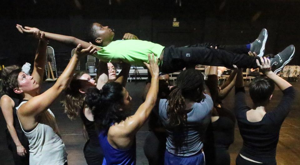 James "J2" Shepherd is carried by his cast mates as they rehearse "The Encounter: Akron" in University of Akron's Sandefur Theatre in Guzzetta Hall. "The Encounter: Akron" is a physical theater work created by choreographer Kimberly Bartosik.