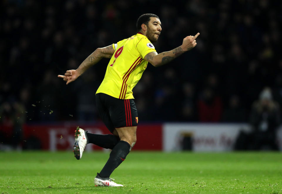 Troy Deeney gives the middle finger to Chelsea fans after his goal from the penalty spot. (Getty)