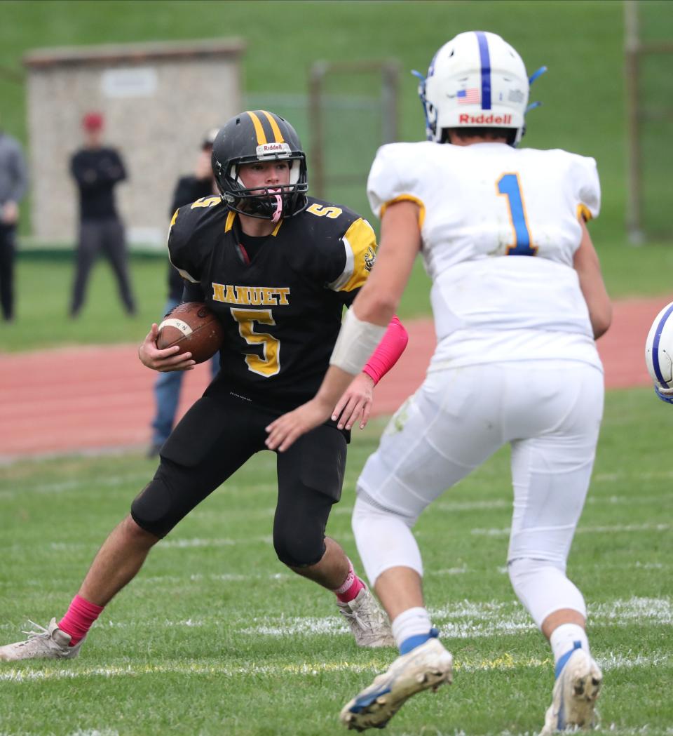 Nanuet's James Moran tries to get past Ardsley's Michael Belarge during their football game at Nanuet Senior High School, Oct. 23, 2021. 