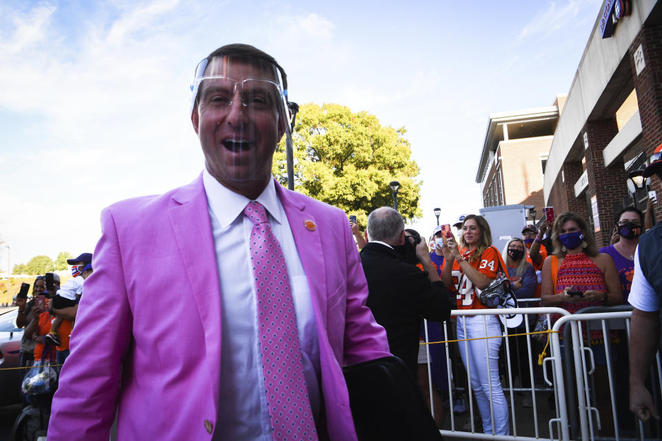 Clemson coach Dabo Swinney walks past fans during the Clemson Tiger Walk before an NCAA college football game against Syracuse on Saturday, Oct. 24, 2020 in Clemson, S.C. (Ken Ruinard/Pool Photo via AP)