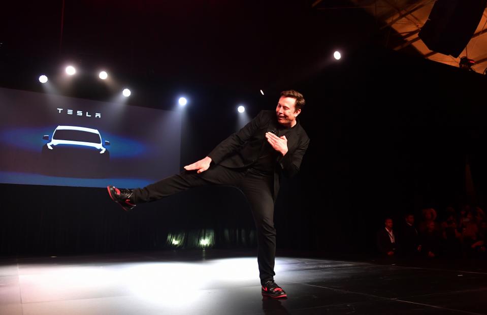 Tesla CEO Elon Musk gestures during the unveiling of the new Tesla Model Y in Hawthorne, California on March 14, 2019. - Tesla introduced a new electric sports utility vehicle slightly bigger and more expensive than its Model 3, pitched as an electric car for the masses. Tesla chief executive Elon Musk showed off the "Model Y" late Thursday, March 14, 2019, at the company's design studio in the southern California city of Hawthorne, and the company began taking orders online. (Photo by Frederic J. BROWN / AFP)        (Photo credit should read FREDERIC J. BROWN/AFP/Getty Images)