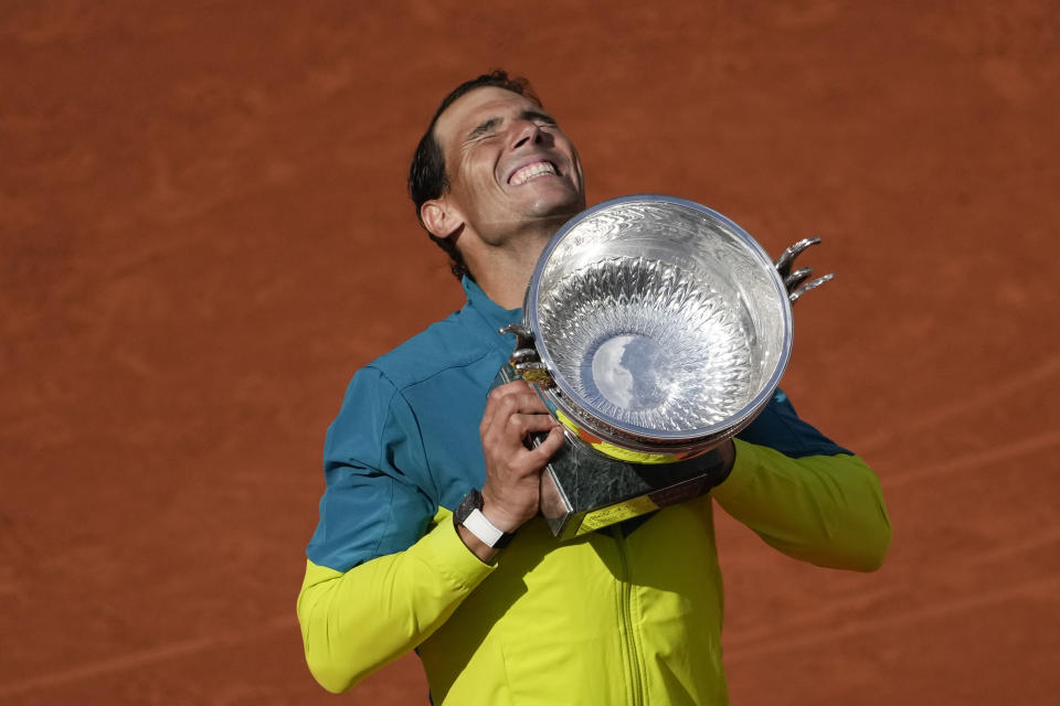 Spain's Rafael Nadal lifts the trophy after winning the final match against Norway's Casper Ruud in three sets, 6-3, 6-3, 6-0, at the French Open tennis tournament in Roland Garros stadium in Paris, France, Sunday, June 5, 2022. (AP Photo/Christophe Ena)