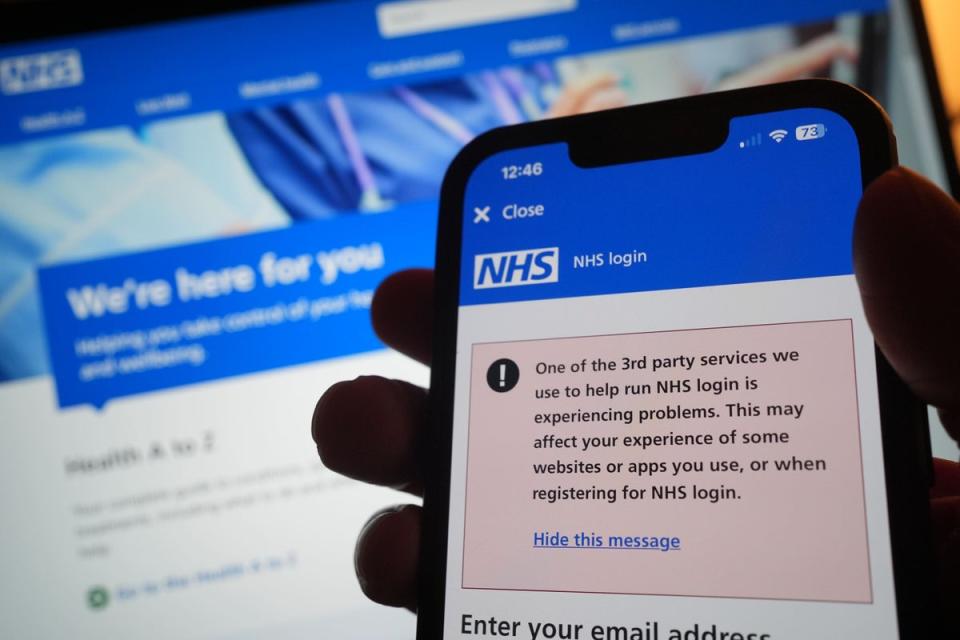 People trying to access the NHS app also encountered problems (PA)