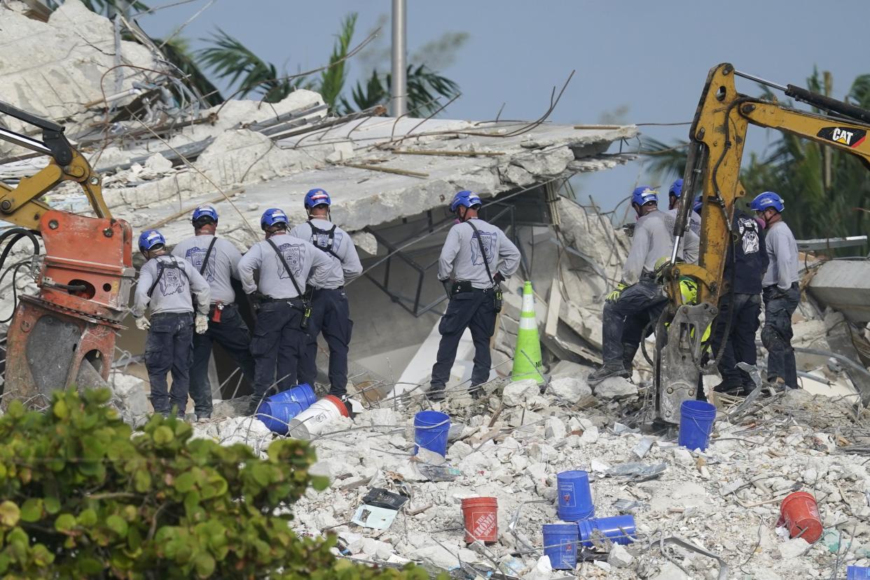 Rescue crews work at the site of the collapsed Champlain Towers South condo building after the remaining structure was demolished Sunday, in Surfside, Fla., Monday, July 5, 2021. Many people are unaccounted for in the rubble of the building which partially collapsed on June 24.