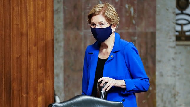 Sen. Elizabeth Warren (D-Mass.) arrives for a Senate Banking, Housing, and Urban Affairs Committee hearing to discuss oversight of the Department of Treasury and Federal Reserve over the CARES Act on Tuesday, November 30, 2021.