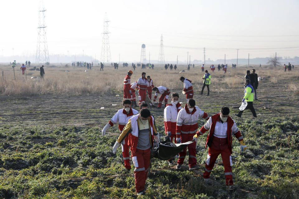 Rescue workers recover the bodies of victims of a Ukrainian plane crash in Shahedshahr, southwest of the capital Tehran, Iran, Wednesday, Jan. 8, 2020.(Photo: Ebrahim Noroozi/AP)