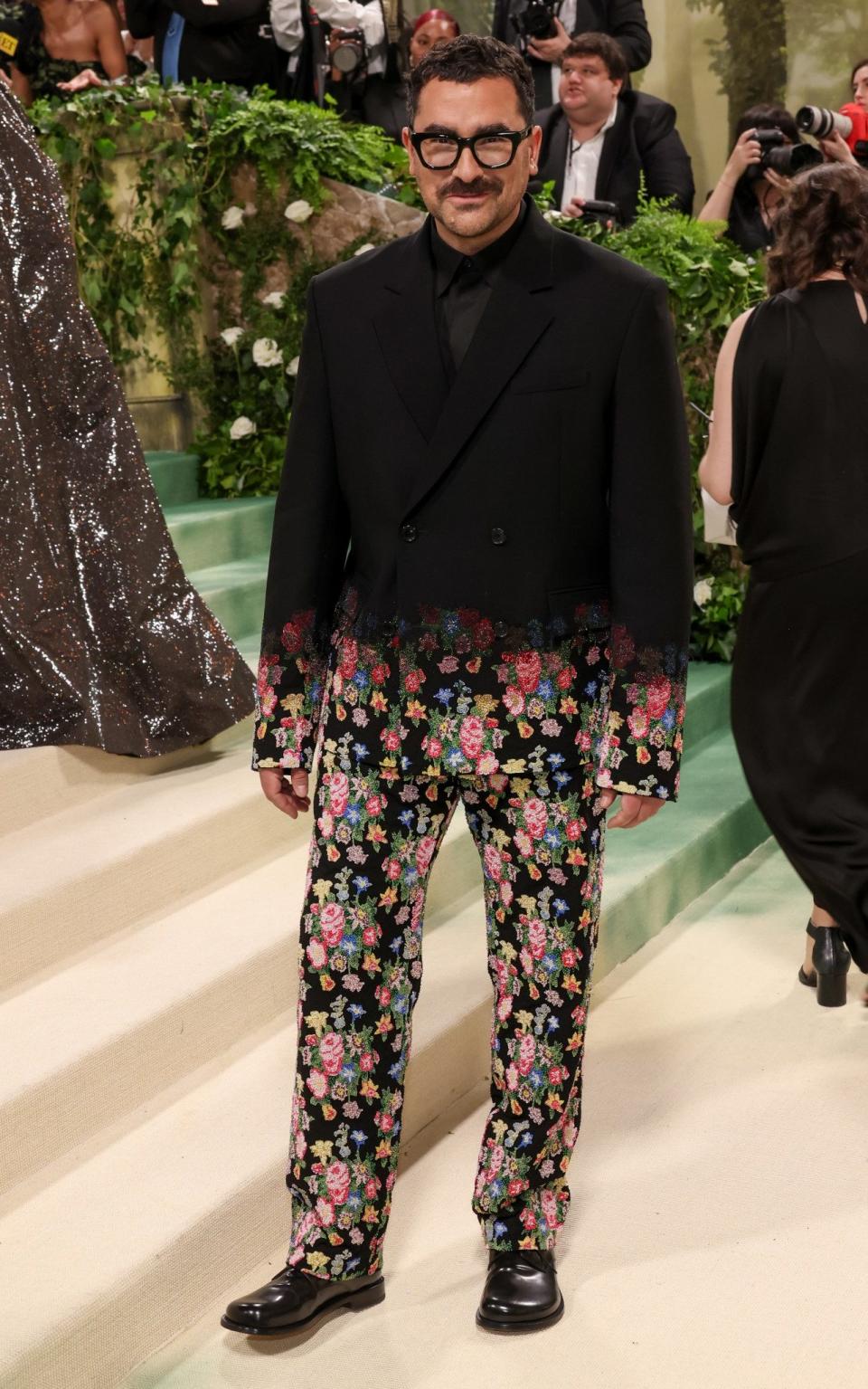 Dan Levy wore an ombre-effect suit by Loewe with a floral lower half