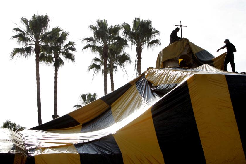 (San Juan) – At Mission San Juan Capistrano, workers tent the North wing, and it's bell tower for fumigation against both drywood and subterranean termites. PHOTOGRAPHED TUESDAY DECEMBER 27, 2005. (Photo by Don Kelsen/Los Angeles Times via Getty Images)