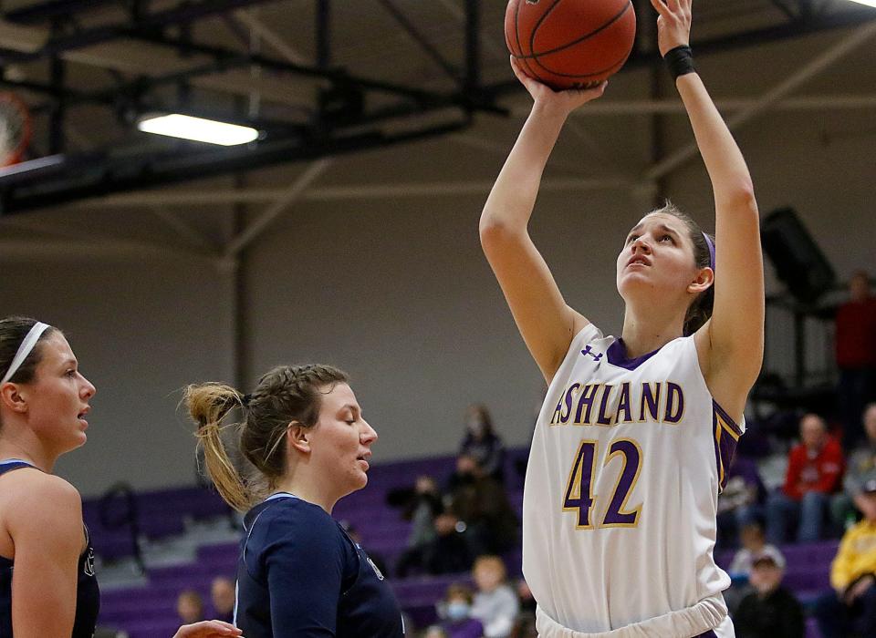 Ashland University's Annie Roshak (42) shoots as Cedarville University's Lexi Moore (44) defends during college women's basketball action Monday, Jan. 24, 2022 at Kates Gym. TOM E. PUSKAR/TIMES-GAZETTE.COM