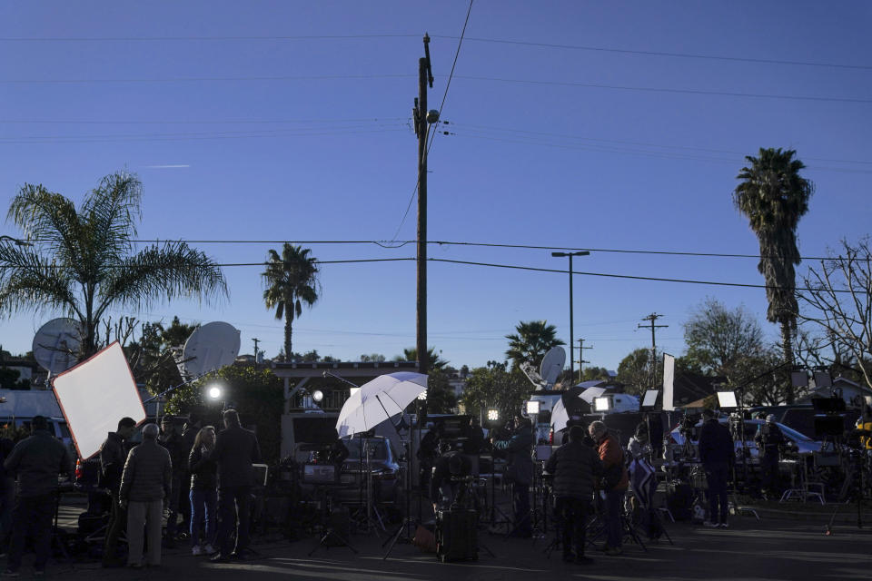 Members of the media are stationed outside Star Dance Studio in Monterey Park, Calif., Monday, Jan. 23, 2023. Authorities searched for a motive for the gunman who killed 10 people at the ballroom dance club during Lunar New Year celebrations, slayings that sent a wave of fear through Asian American communities and cast a shadow over festivities nationwide. (AP Photo/Jae C. Hong)