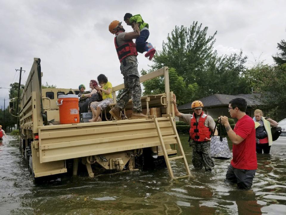 A photo made available by the Texas Military Department shows Texas National Guard soldiers arriving to aid citizens in heavily flooded areas in Houston. (Photo: REUTERS)