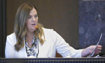 Jessica Hawkins, senior director of prevention services with the Oklahoma Department of Mental Health and Substance Abuse Services, testifies during the opioid trial Monday, June 24, 2019 in Norman, Okla. (AP Photo/Sue Ogrocki, Pool)