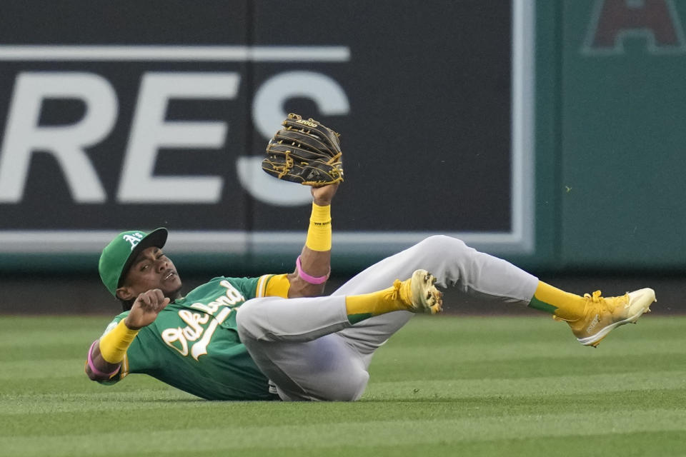 Oakland Athletics center fielder Esteury Ruiz (1) catches a fly ball hit by Los Angeles Angels' Anthony Rendon during the second inning of a baseball game in Anaheim, Calif., Monday, April 24, 2023. (AP Photo/Ashley Landis)