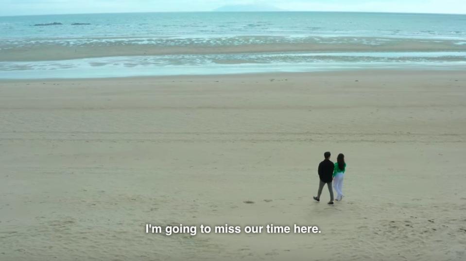 Jun-sik and Yea-won walk on the beach saying they'll miss their time on the island