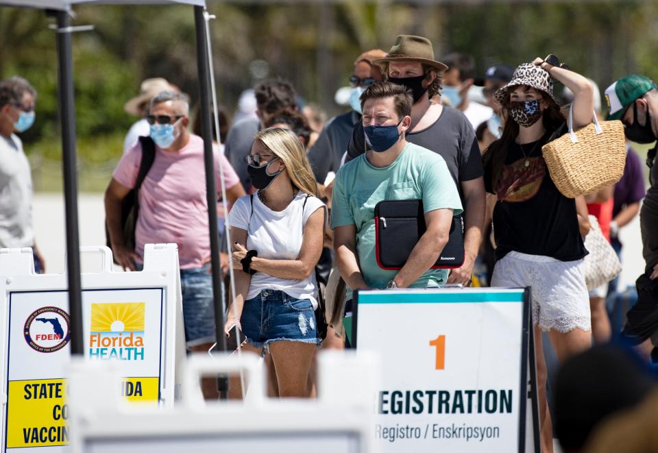 People line up to receive a Johnson & Johnson vaccine in Miami Beach on May 2, 2021.