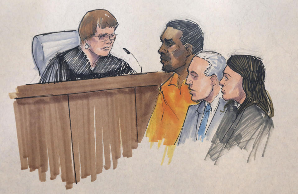 In this courtroom sketch, R&B singer R. Kelly, center, appears before U.S. Magistrate Shelia M. Finnegan, left, in U.S. District Court for the Northern District of Illinois. Friday, July 12, 2019, in Chicago. Also standing with Kelly is his attorney Steve Greenberg and an unidentified prosecutor. (AP Photo/Tom Gianni via AP)