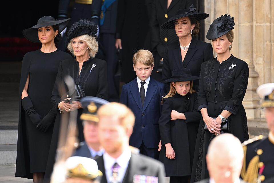 Meghan, Duchess of Sussex, Camilla, Queen Consort, Prince George of Wales, Catherine, Princess of Wales, Princess Charlotte of Wales and Sophie, Countess of Wessex during the State Funeral of Queen Elizabeth II at Westminster Abbey on September 19, 2022 in London, England.