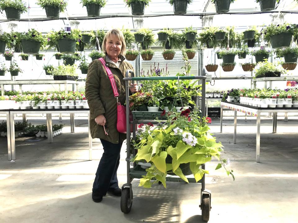 Berkley resident Nicole Pires purchased a variety of cut flowers at Araujo Farms & Greenhouses on Monday, May 1, 2023, as gifts for her adult children.