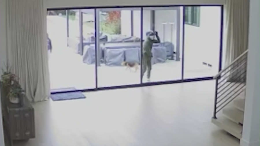 Security footage shoes one of two burglars looking into a Lakewood home when the occupants were not home. The victim says the thieves stole cash, jewelry and a safe before fleeing. The victim spoke with KTLA on April 27, 2024. (KTLA)