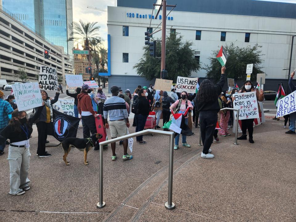 Pro-Palestinian supporters rallying against the Israel-Hamas conflict gather outside of The Arizona Republic on the corner of Van Buren Street and 2nd Street.