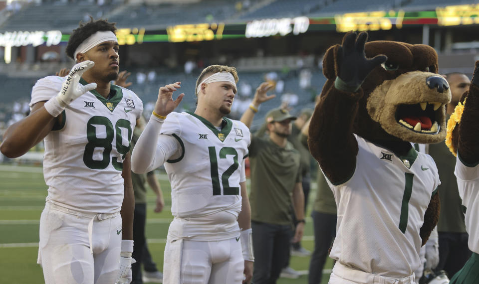 Baylor quarterback Blake Shapen (12) and tight end Drake Dabney (89) reflect their loss to Houston following an NCAA college football game, Saturday, Nov. 4, 2023, in Waco, Texas. (Rod Aydelotte/Waco Tribune-Herald via AP)