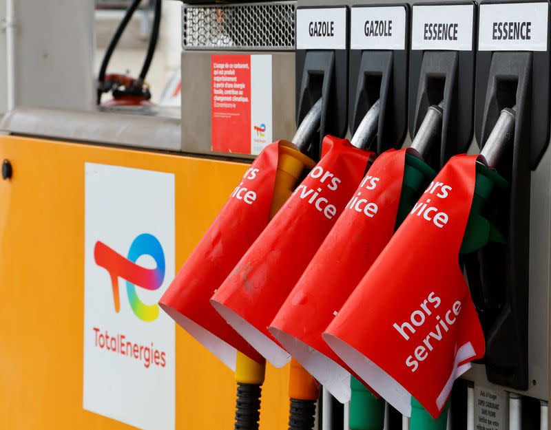 Signs which read "out of order" are seen on gasoline pumps at a TotalEnergies gas station in Nice