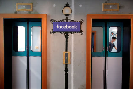 A facsimile metro sign is seen between elevators at the entrance of France's Facebook headquarters in Paris, France, May 15, 2018. REUTERS/Charles Platiau