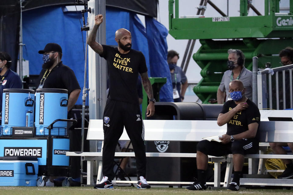 Montreal Impact coach Thierry Henry, left, gestures on the sideline during the first half of an MLS soccer match against Toronto FC, Thursday, July 16, 2020, in Kissimmee, Fla. (AP Photo/John Raoux)