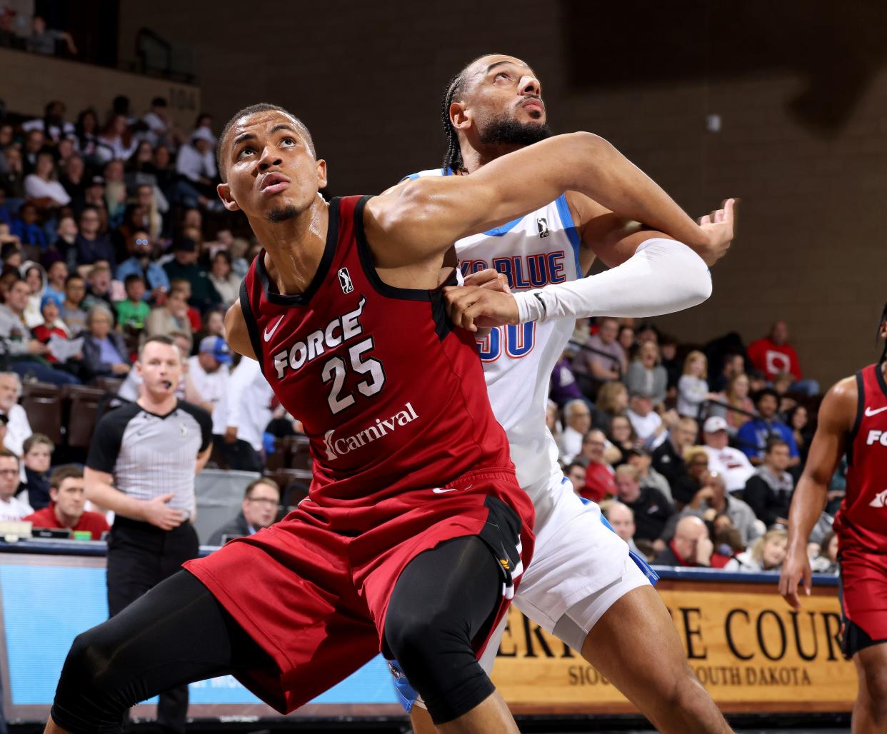 Orlando Robinson #25 of the Sioux Falls Skyforce battles for position with Olivier Sarr #30 of the Oklahoma City Blue during a 2023-24 playoff game at the Sanford Pentagon on April 5, 2024 in Sioux Falls, South Dakota.