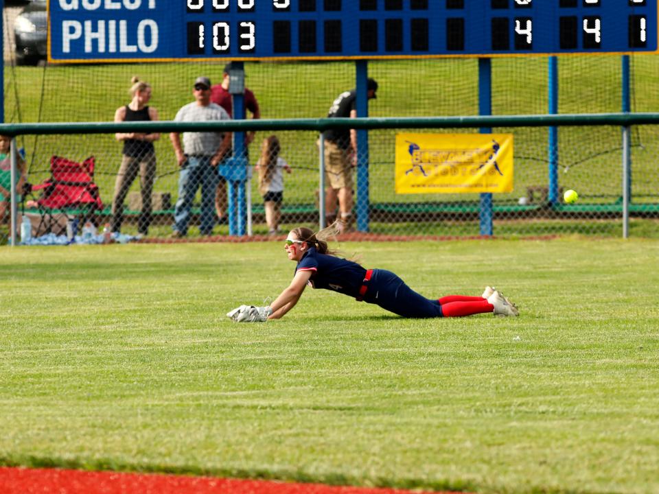 Morgan's Myka Augentein tries to make a diving catch in center field during a 6-0 loss to John Glenn in a Division II district semifinal on Monday at the Philo Athletic Complex in Duncan Falls.