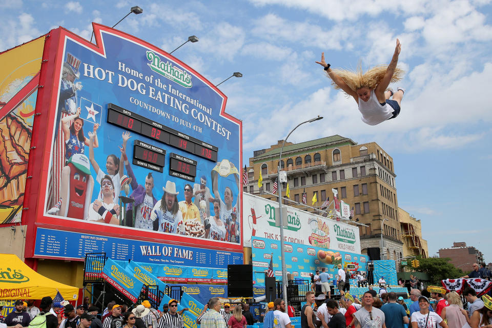 <p>A person jumps on a trampoline before Nathan’s Famous Fourth of July International Hot Dog-Eating Contest at Coney Island in Brooklyn, New York City, U.S., July 4, 2017. (Andrew Kelly/Reuters) </p>