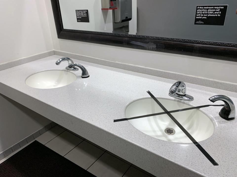 <span class="caption">A sink in a bathroom in Allen, Texas on May 1, 2020 is closed off to enforce social distancing.</span> <span class="attribution"><a class="link " href="https://www.gettyimages.com/detail/news-photo/hand-sink-in-the-mens-restroom-is-taped-off-in-an-effort-to-news-photo/1222298414?adppopup=true" rel="nofollow noopener" target="_blank" data-ylk="slk:Ronald Martinez/Getty Images;elm:context_link;itc:0;sec:content-canvas">Ronald Martinez/Getty Images</a></span>