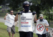 <p>Counterprotesters hold signs before conservative organizers begin a planned “Free Speech” rally on Boston Common, Saturday, Aug. 19, 2017, in Boston. (Photo: Michael Dwyer/AP) </p>