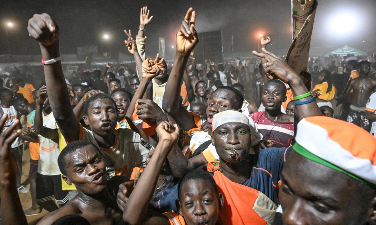 <span>Ivory Coast's supporters celebrate after their dramatic win over Mali.</span><span>Photograph: Sia Kambou/AFP/Getty Images</span>