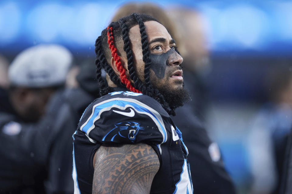 FILE - Carolina Panthers linebacker Frankie Luvu stands on the sideline prior to an NFL football game against the Atlanta Falcons, Dec. 17, 2023, in Charlotte, N.C. Washington reached an agreement Monday, March 11, 2024, to sign linebacker Luvu. The contract for Luvu is for three years and worth up to $63 million, according to his agency, Team IFA. (AP Photo/Brian Westerholt, File)