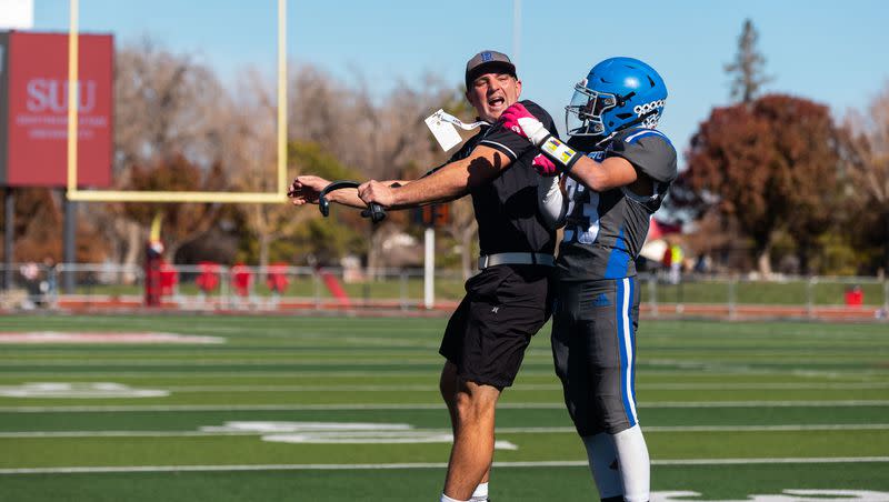Rich High School’s Drake Weston celebrates with his coach in the final quarter of the 1A 8-player football state championship against Monticello High School at Southern Utah University in Cedar City on Saturday, Nov. 11, 2023. Rich won the game 35-20.